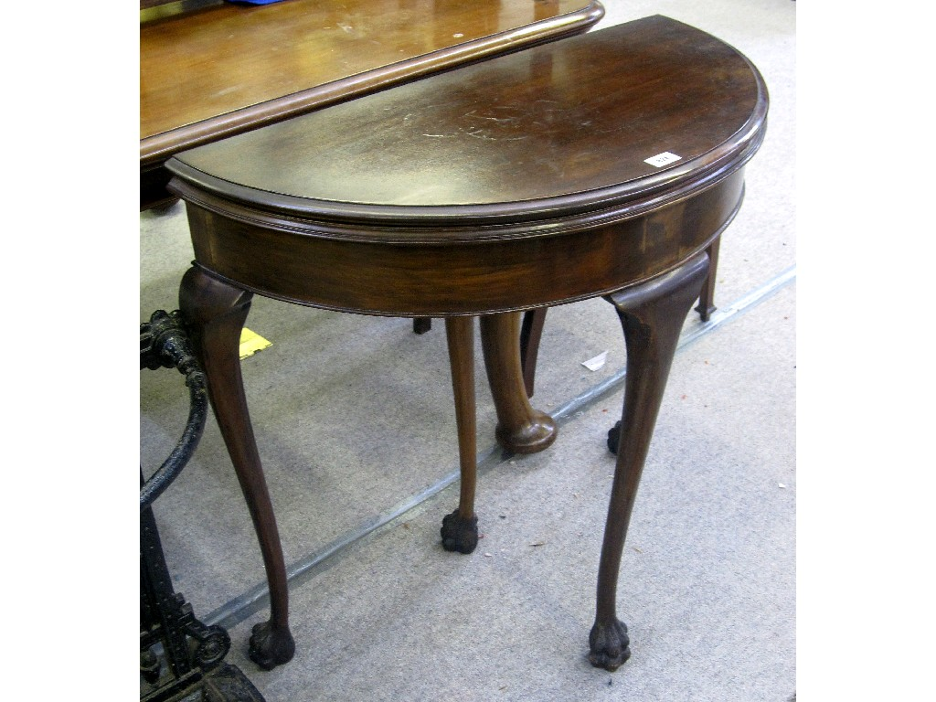 Mahogany demi lune fold over card table on hairy paw