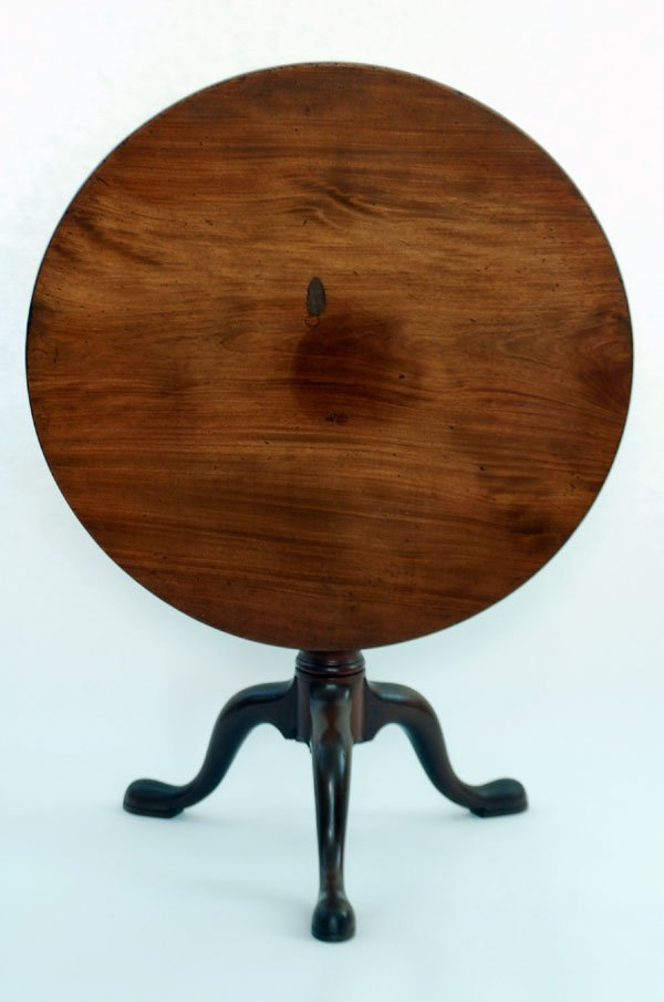 Tilt top tea table with a column center with three