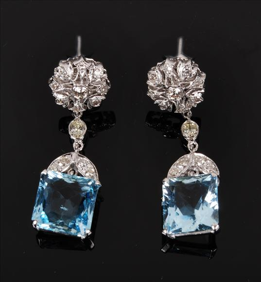 A pair of aquamarine and diamond earrings the square aquamarine