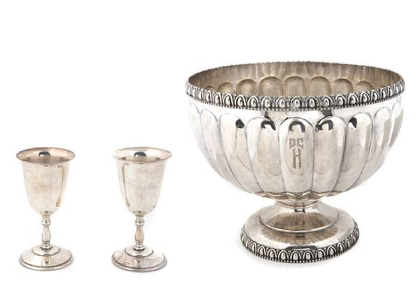 A silver plate punch bowl with a set of twelve