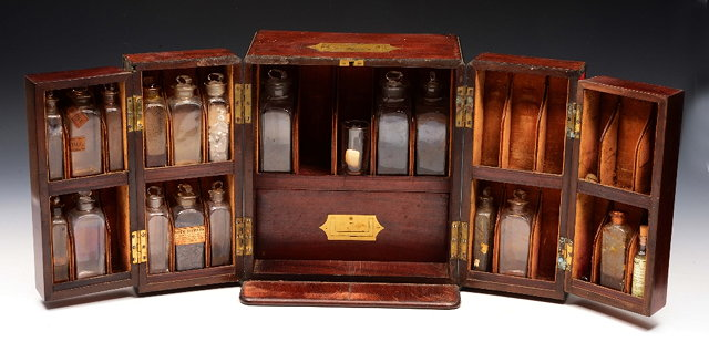 A LATE GEORGIAN MAHOGANY APOTHECARY S CABINET with brass inset