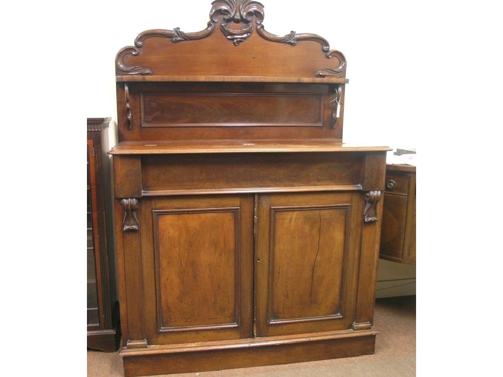 An early Victorian mahogany chiffonier modified raised back with over