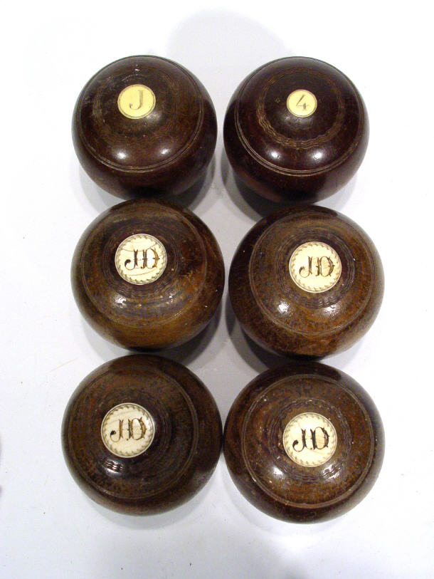 Two Thomas Royle ivory inlaid wooden carpet bowls and four