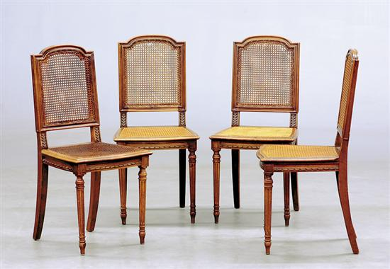 Four Louis XVI style carved fruitwood side chairs late 19th