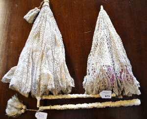 Two 19th century French silk and lace folding parasols one
