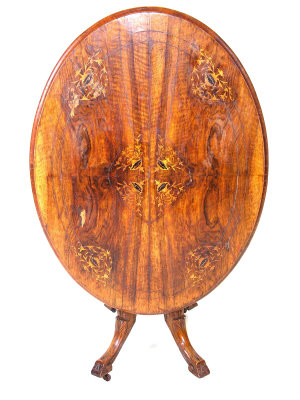 A Victorian walnut loo table the foliate inlaid top upon