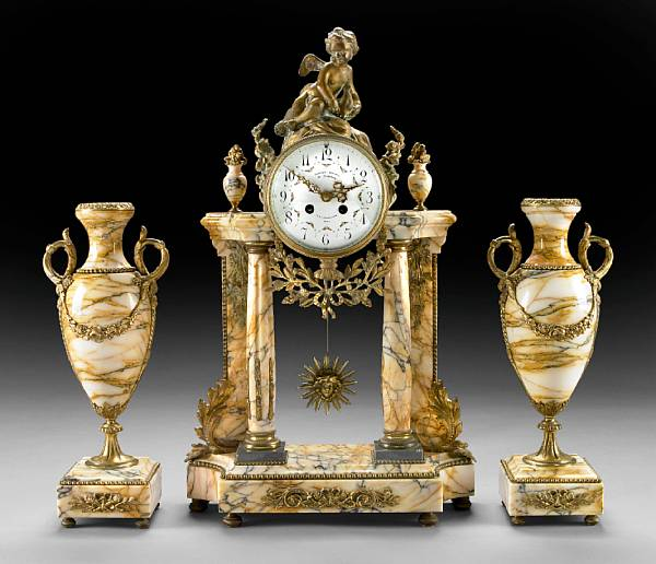 A French marble and gilt metal mounted clock garniture early