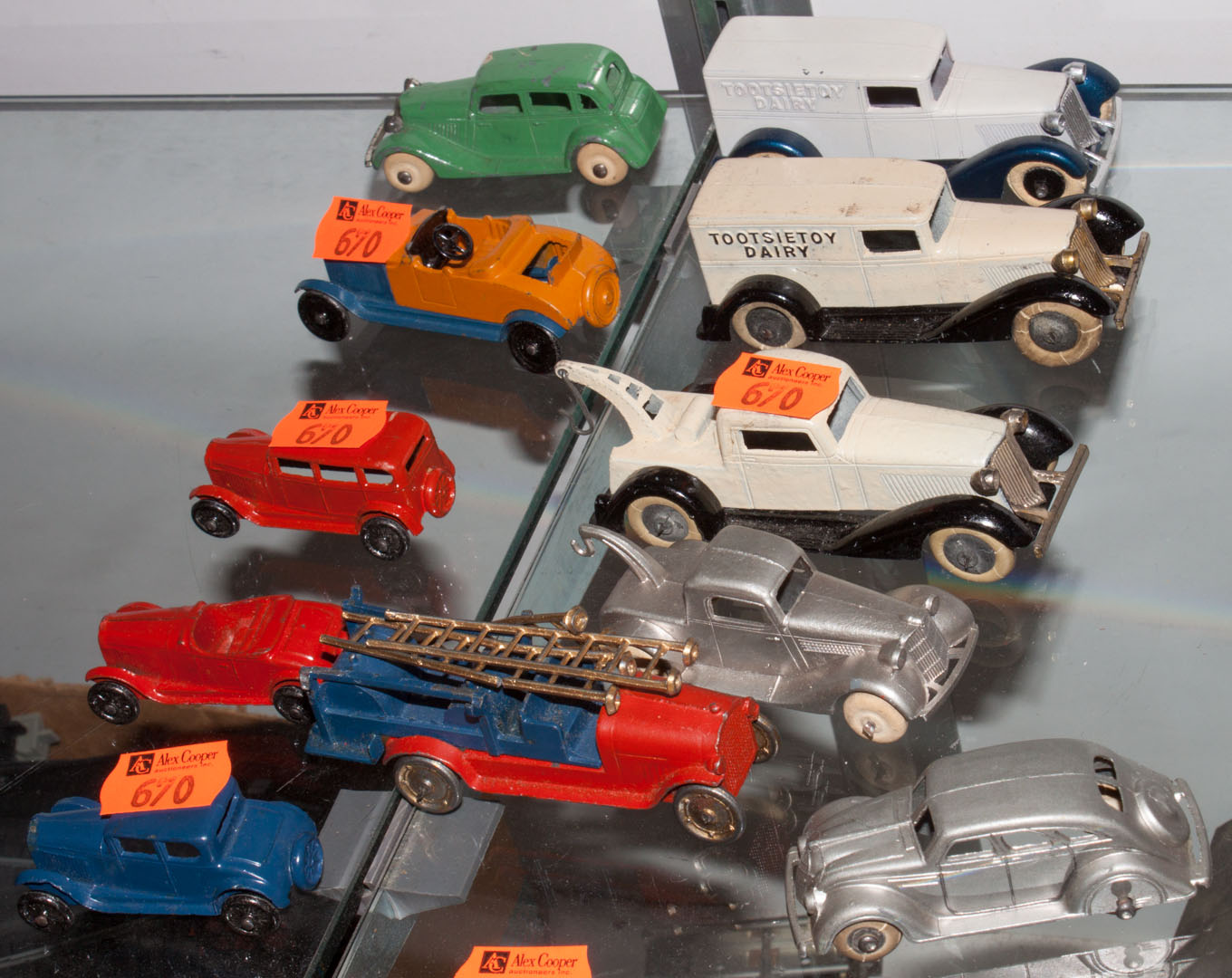 assorted Tootsie toys circa 1930s 1970s including tow trucks delivery