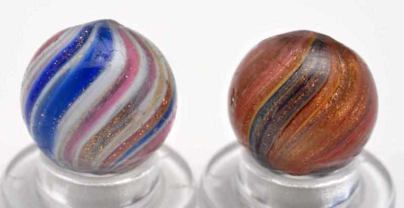 Lot of 2 Onionskin Lutz Marbles Description The smaller marble