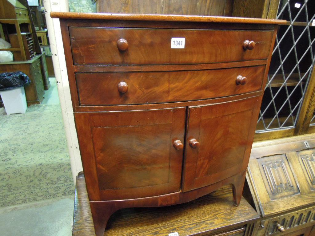A 19th century mahogany bow fronted commode with well matched