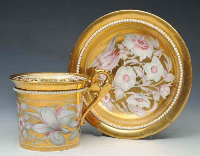 A DERBY GOLD GROUND CABINET CUP AND SAUCER circa 1820