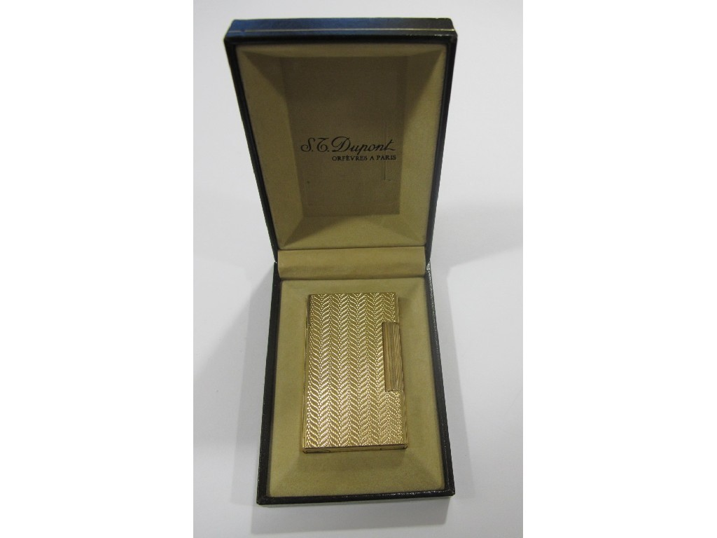 Dupont gold plated cigarette lighter with engine turned chevron decoration