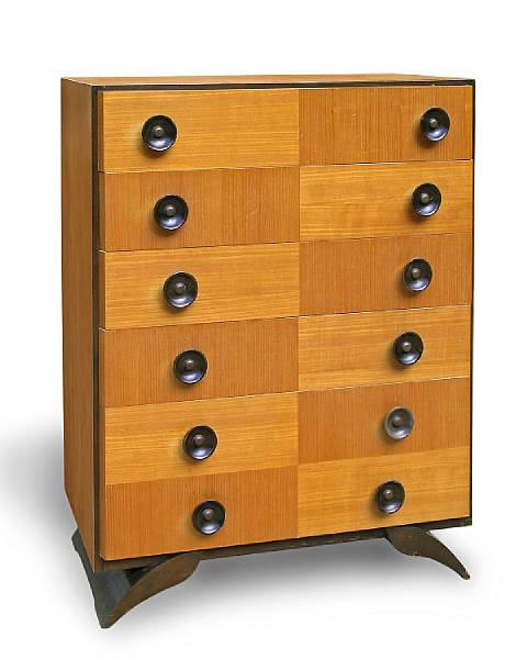 A Gilbert Rohde walnut and American ash chest of drawers