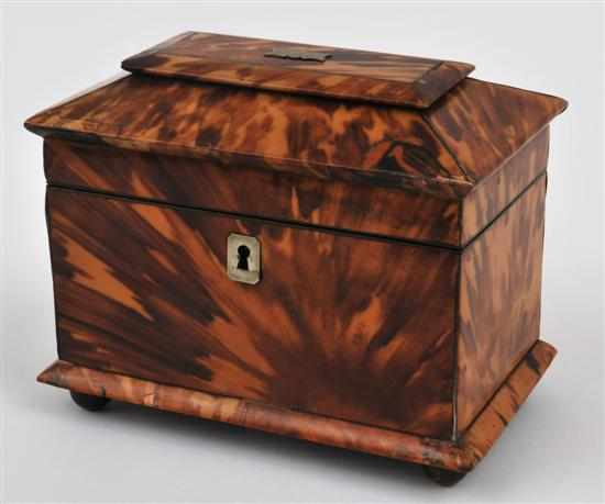 A small tortoiseshell tea caddy Circa 1860 The sarcophagus shaped