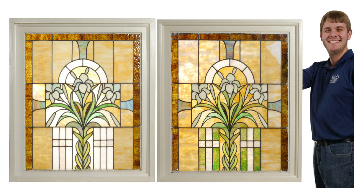 PAIR OF FRAMED STAINED GLASS PANELS Central lily with 3