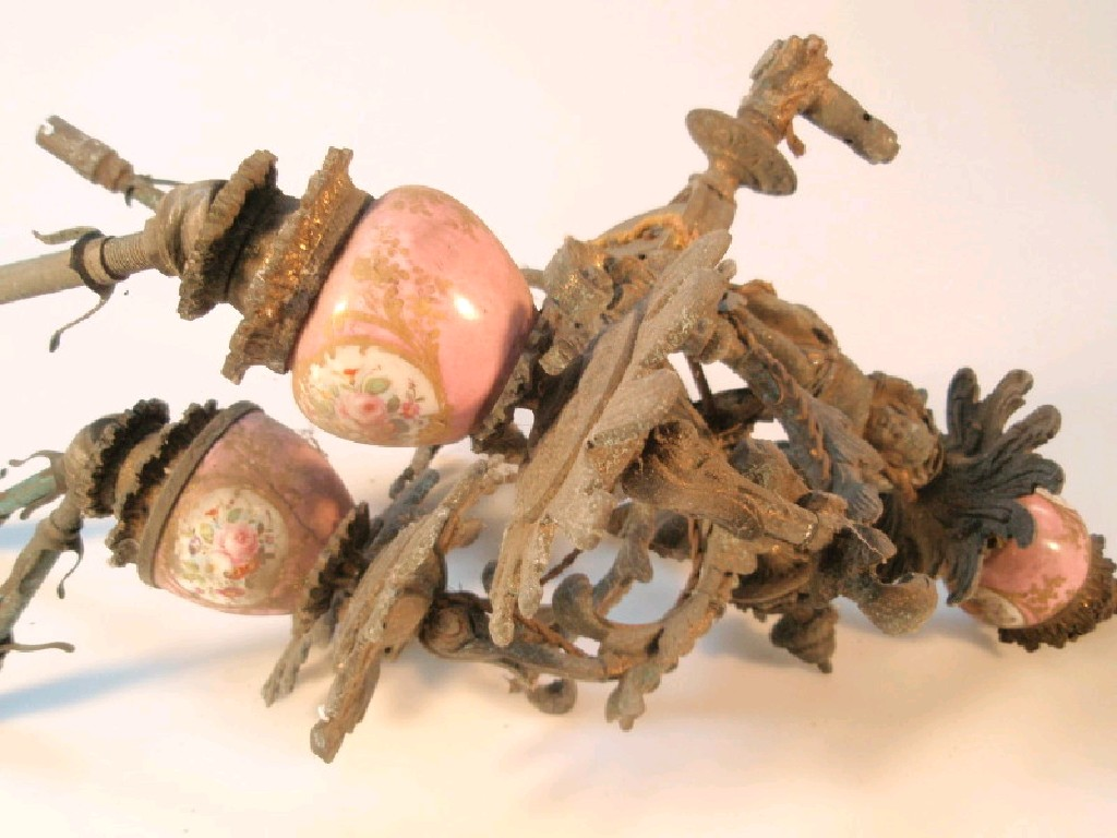 A 19thC gilt metal and porcelain gas bracket with four