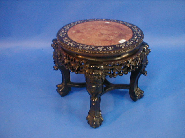 A Chinese carved rose wood low jardiniere stand with mother