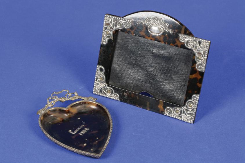 A VICTORIAN SILVER MOUNTED TORTOISESHELL PHOTOGRAPH FRAME of shaped rectangular