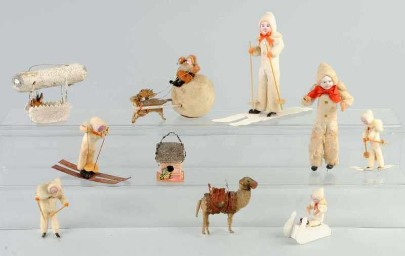 Lot of 10 Cotton Figures Description Includes five skiers one