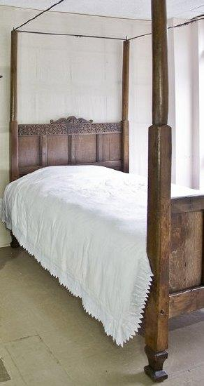 An oak four poster bed 17th Century and later the