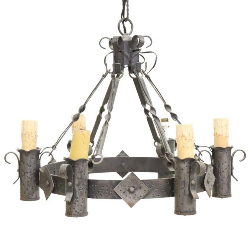 Medieval style wrought iron six light chandelier issuing six twisted