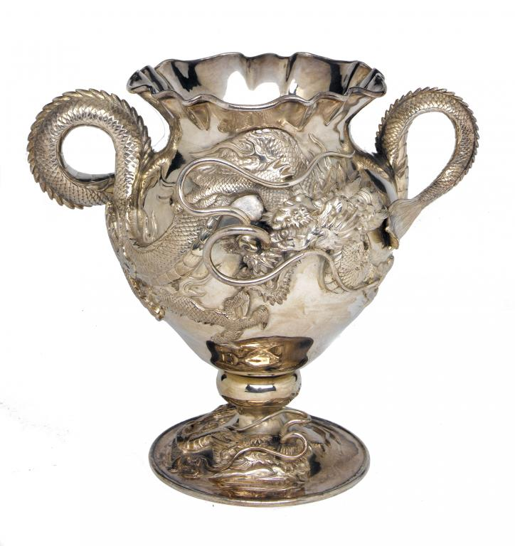 A CHINESE REPOUSS VASE worked in high relief with dragons