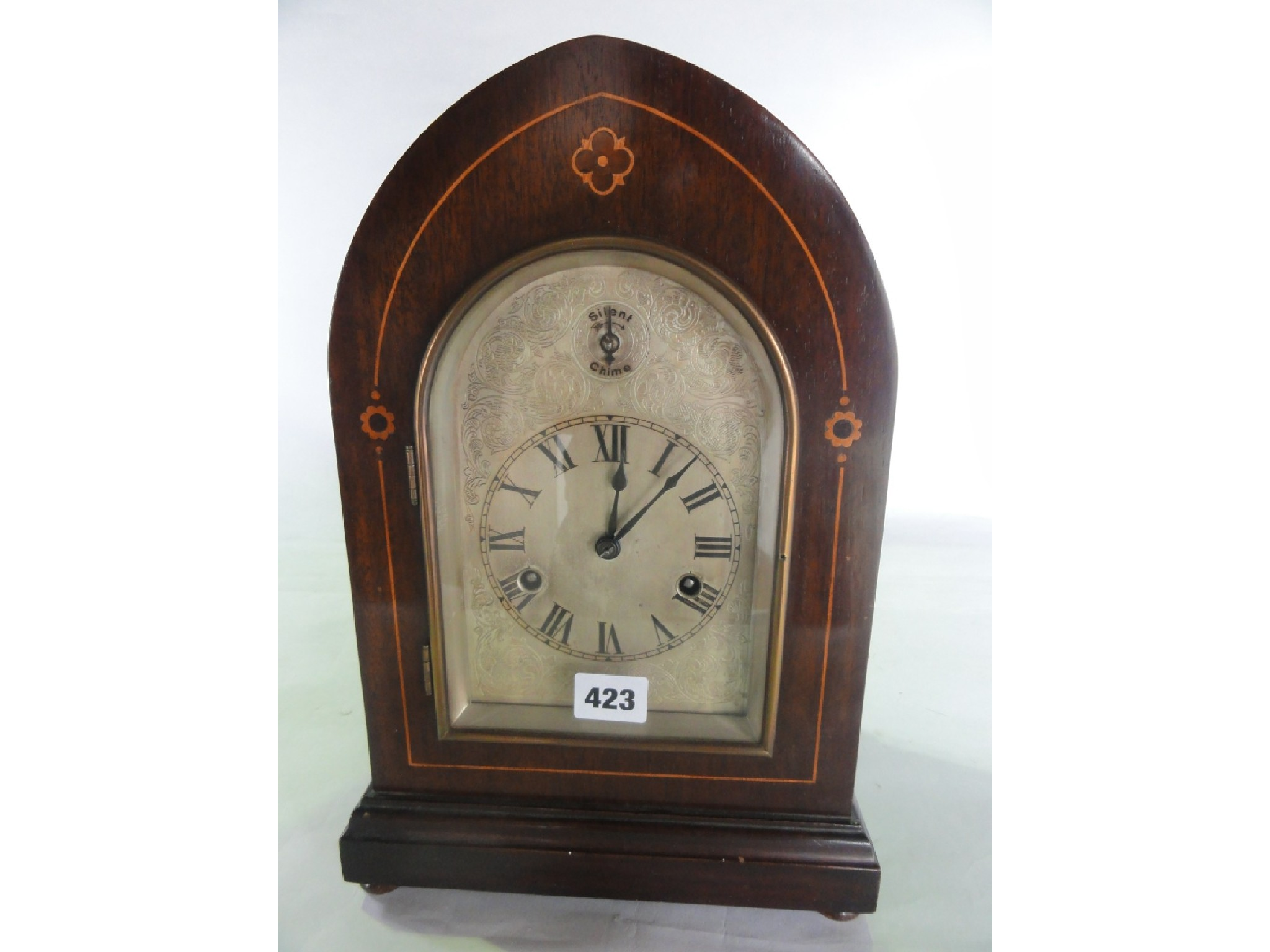 An Edwardian lancet shaped mantel clock with boxwood string inlay