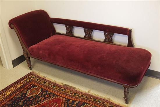 VICTORIAN FAINTING COUCH Walnut with carved and incised decoration turned