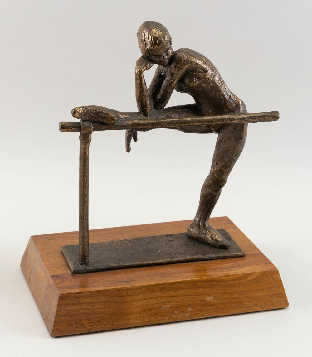 BRONZE SCULPTURE OF A BALLERINA STRETCHING AT A BARRE CIRCA