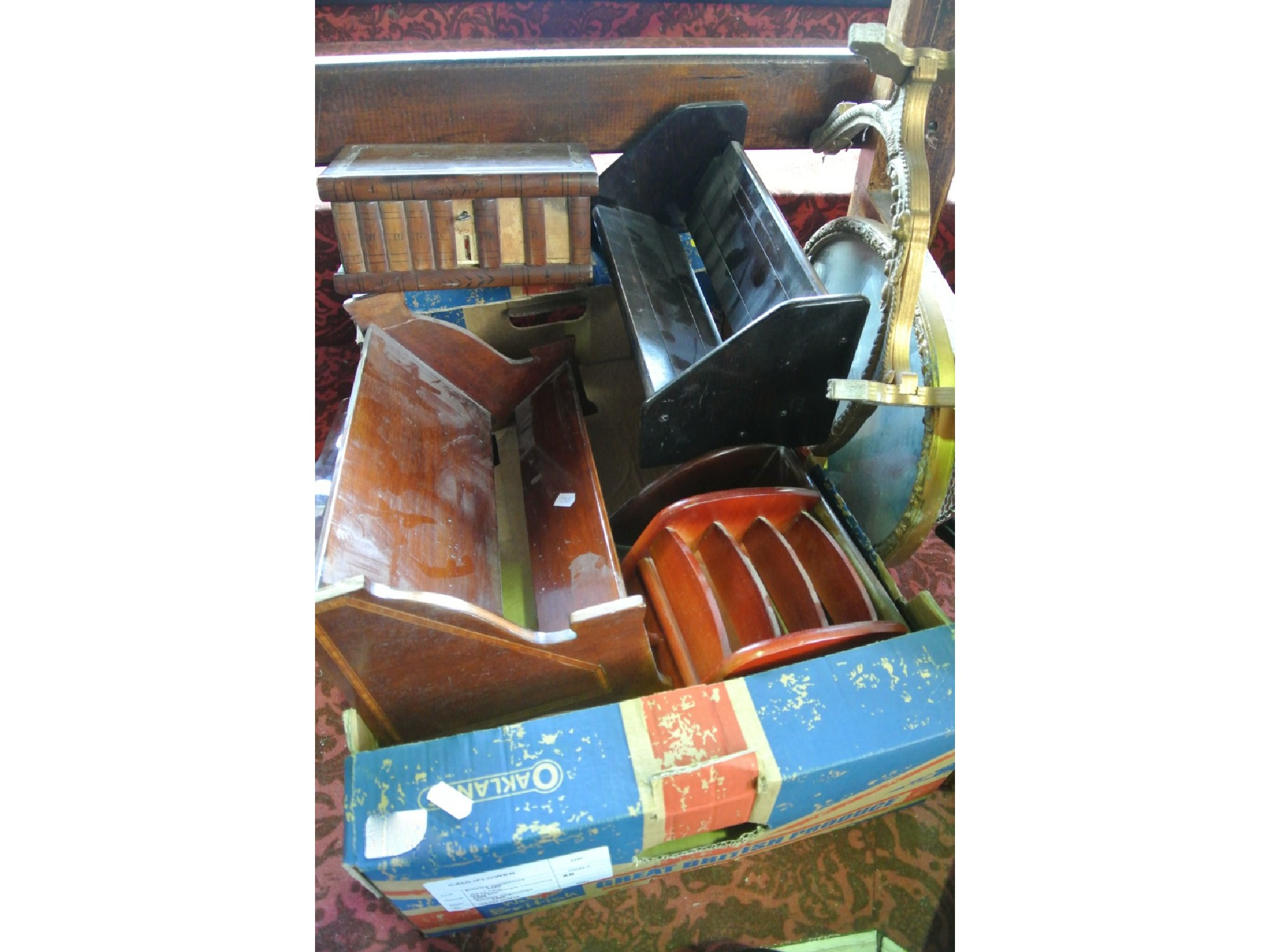 An ebonised timber extending book trough together with one other