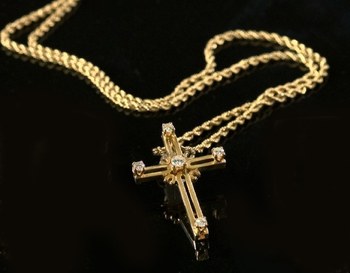 Fourteen Karat Yellow Gold and Diamond Cross and Chain composed