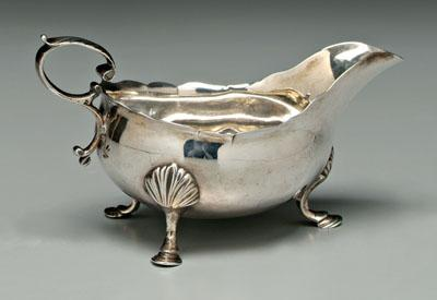 George III silver gravy pitcher oval with wave rim leaf