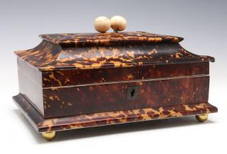 Of sarcophagus form the tapered rectangular case with hinged lid