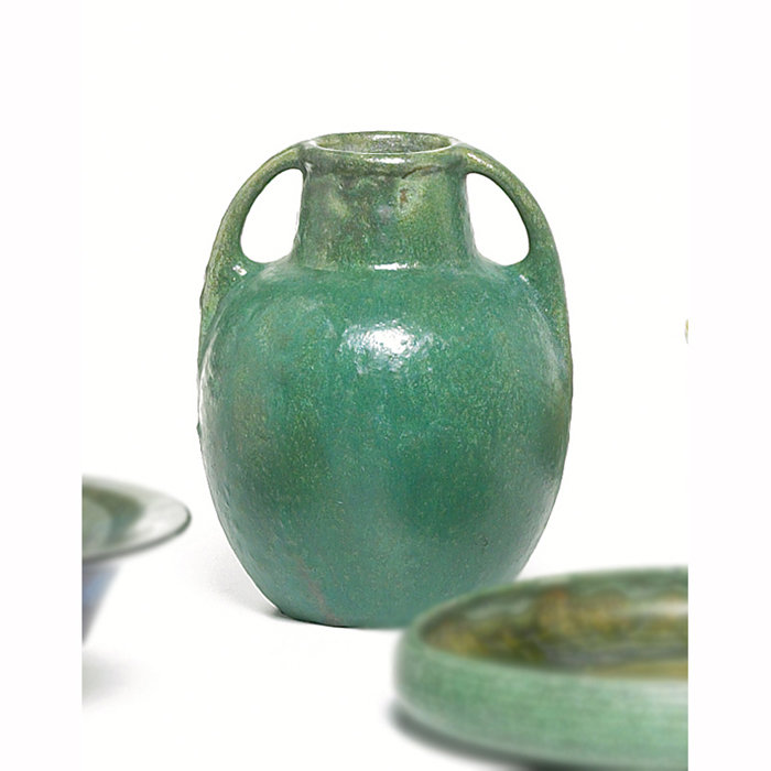 Fulper vase double handled form covered with a green crystalline