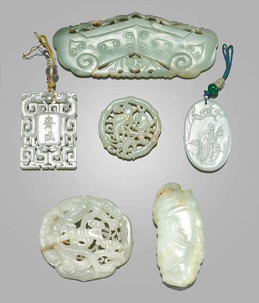 Three small nephrite carvings The first an oval plaque carved