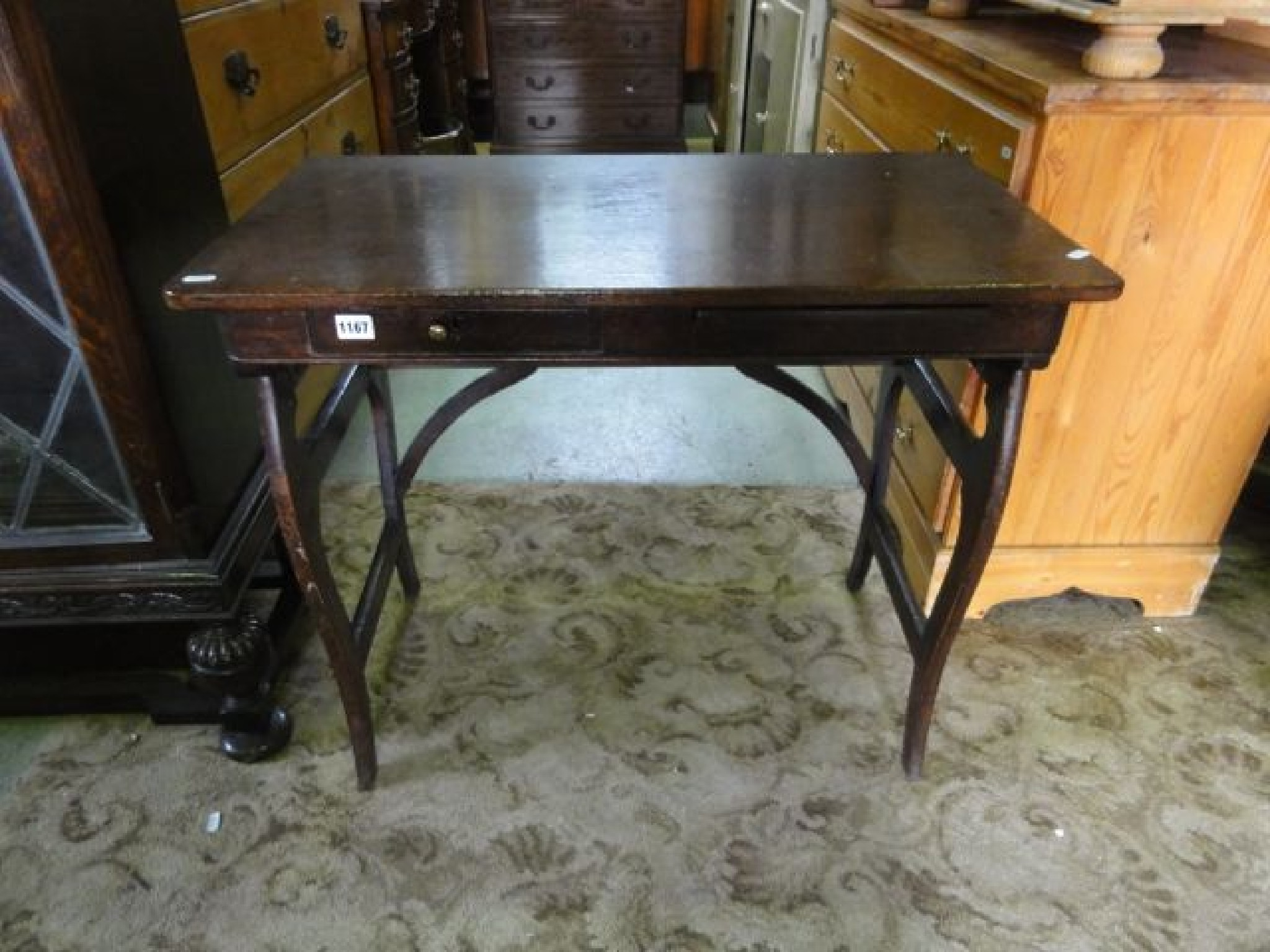 An Arts and Crafts style stained oak side table with