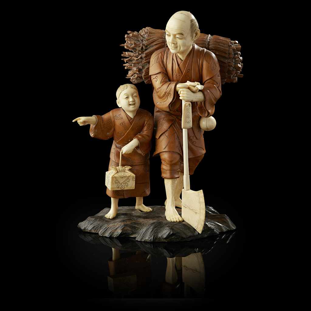 YIVORY AND BURRWOOD OKIMONO OF A WOODCUTTER SIGNED MUNEYASU MEIJI