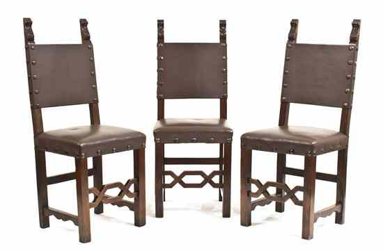 A Set of Six Tuscan Walnut Side Chairs having acanthus