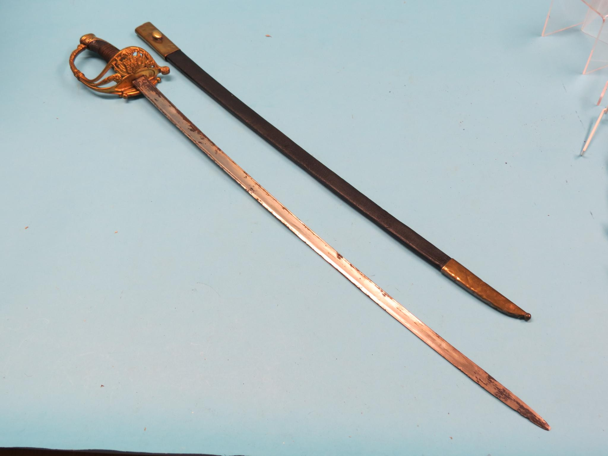 A dress sword brass hilt stamped A Feu wire grip