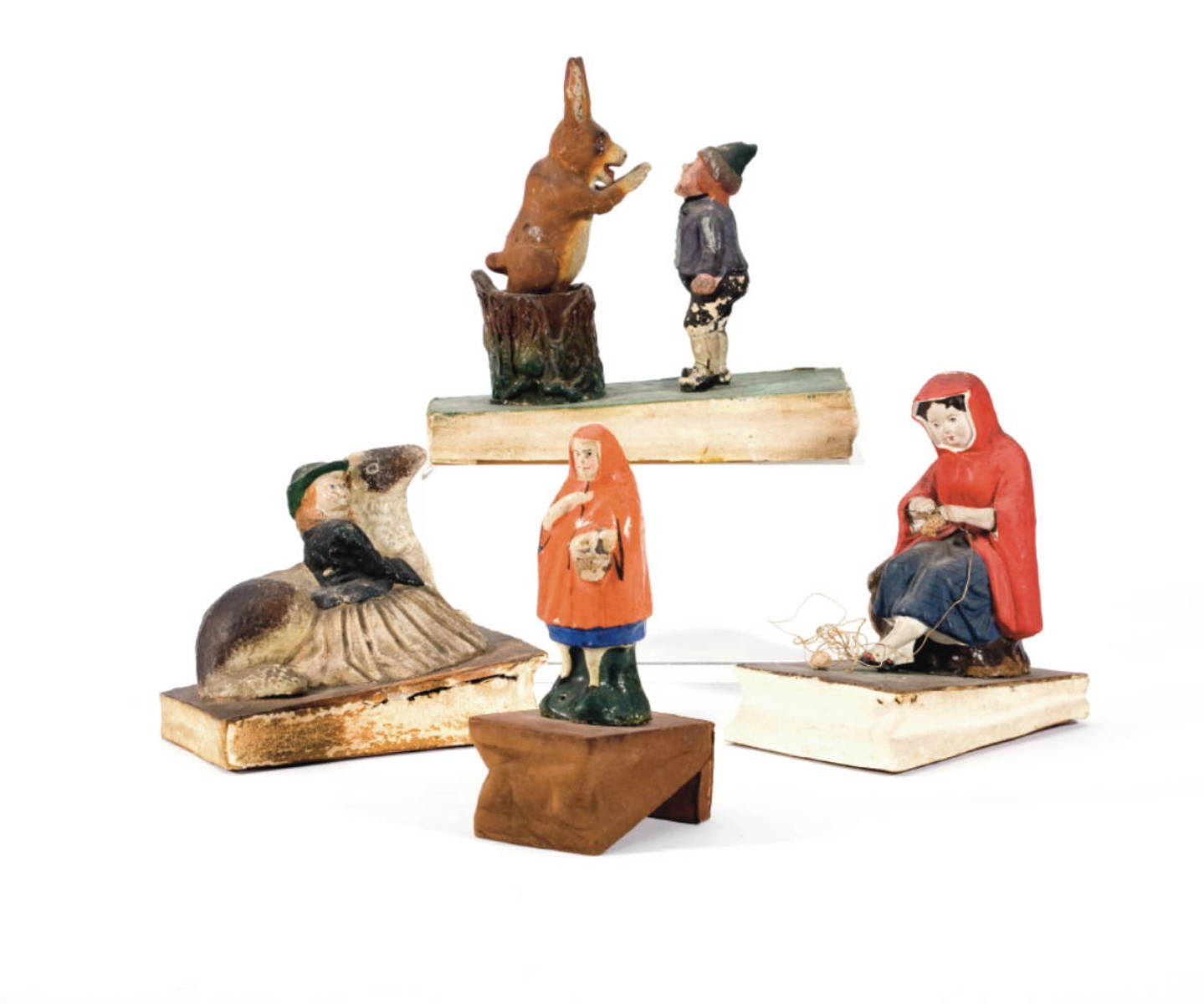 FOUR PAINTED PAPIER MACHE WOOD AND LEATHER SQUEAK TOYS PERTAINING
