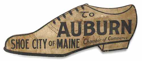 Trade sign in the form of a lace up shoe
