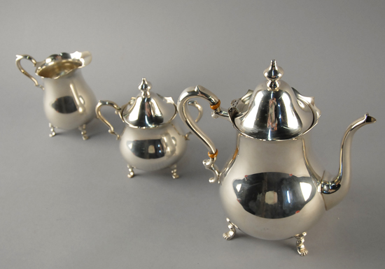 A Three Piece Sterling Tea Service by Preisner to include