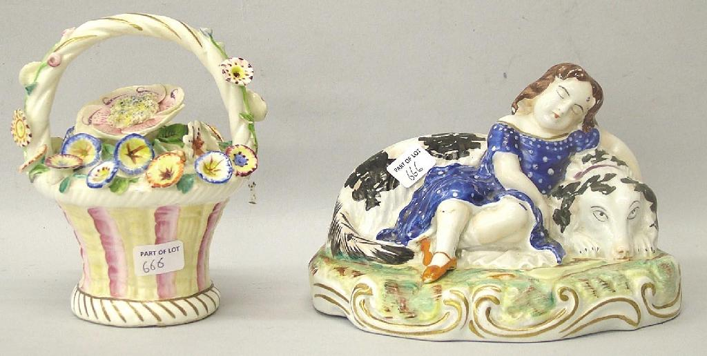 Staffordshire group modelled as a young girl in a blue