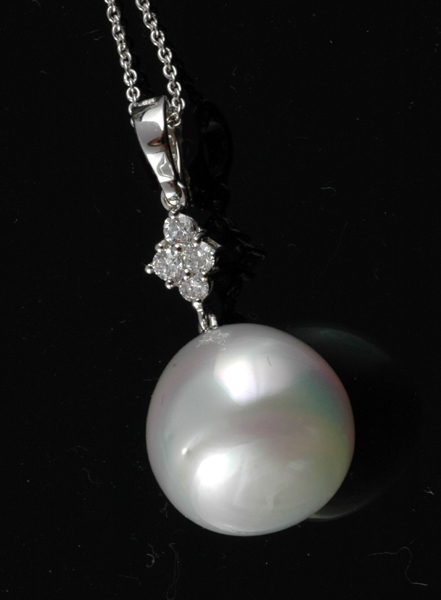 A SOUTH SEA PEARL AND DIAMOND PENDANT The drop shaped