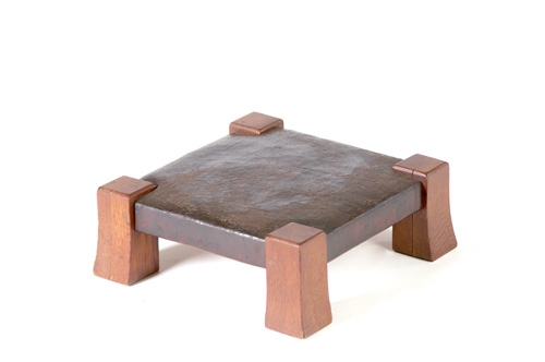 GUSTAV STICKLEY Stool with short flaring legs and a tacked