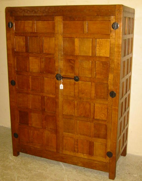 AN OAK WARDROBE by Robert Mouseman Thompson of multi panel