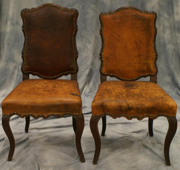 Pr Louis XV style French side chairs with worn leather