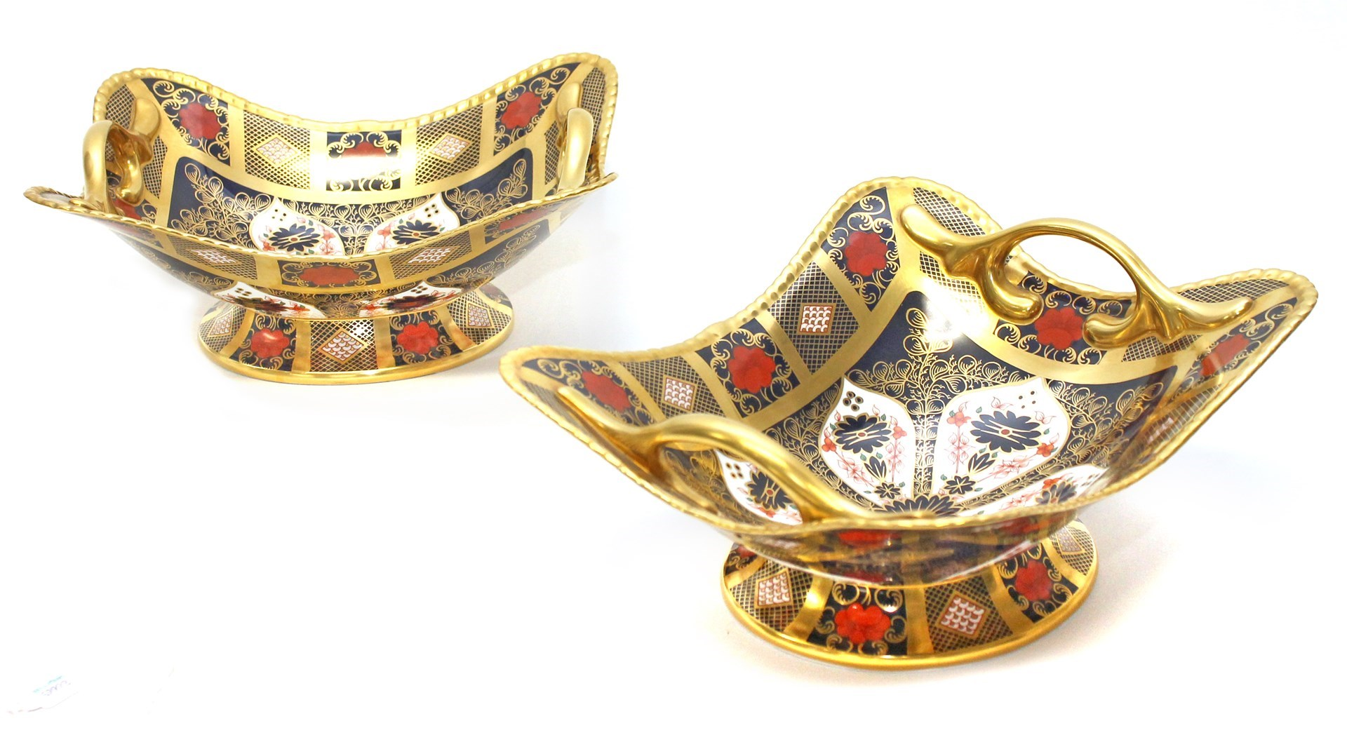 A pair of Royal Crown Derby porcelain two handled baskets