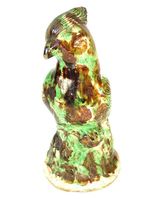 Pottery figure of a bird in green and brown glazes