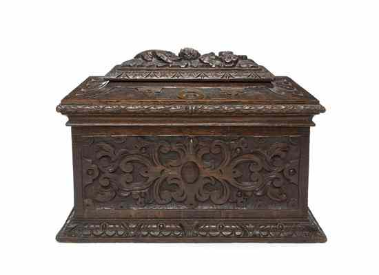 A Carved Oak Tea Caddy having a rectangular hinged top